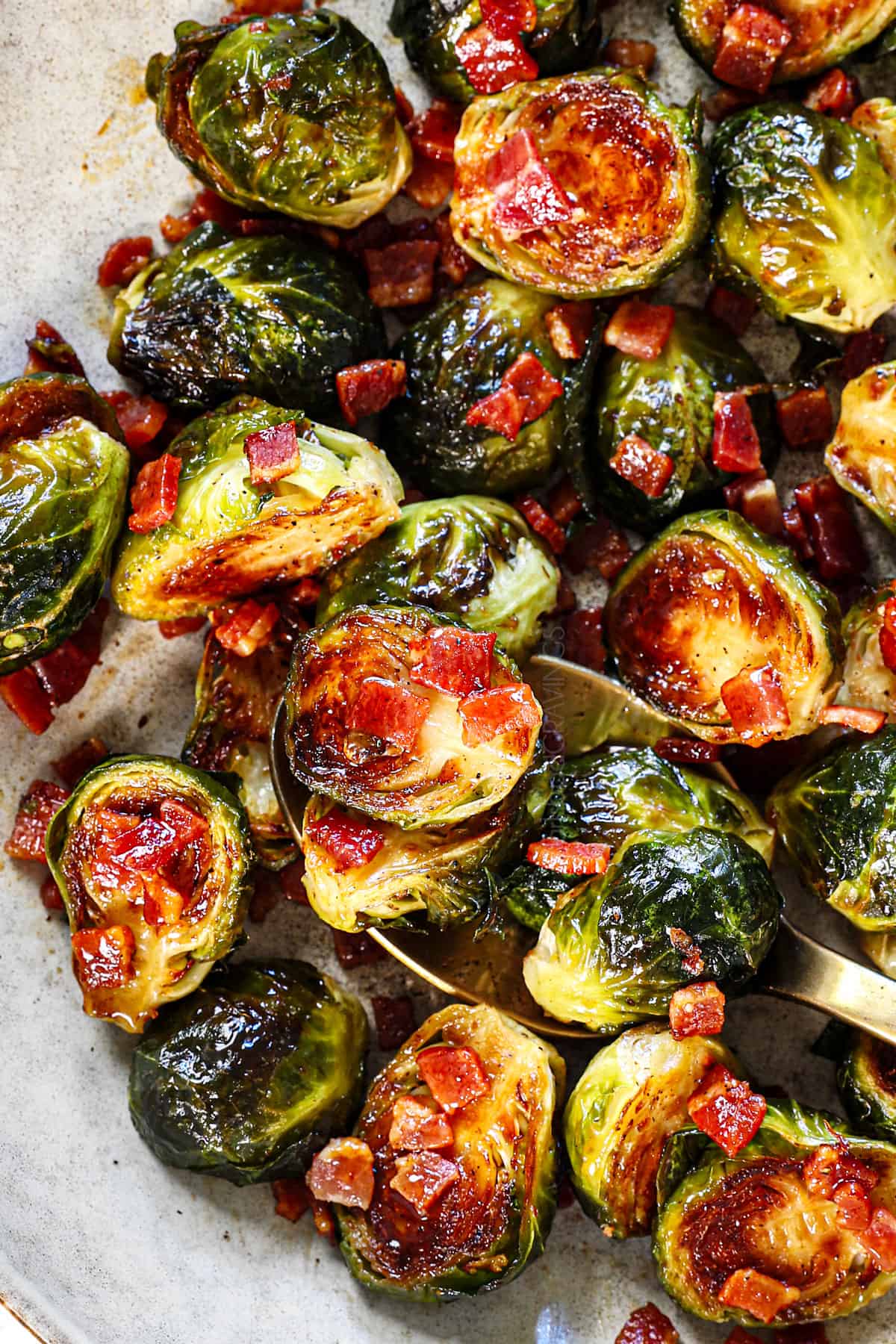 showing how to serve Brussel sprouts and bacon on a platter