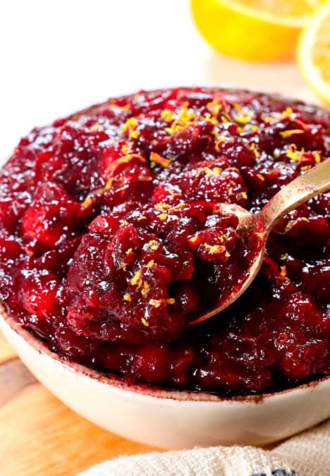 recipe for cranberry sauce being spooned showing the texture