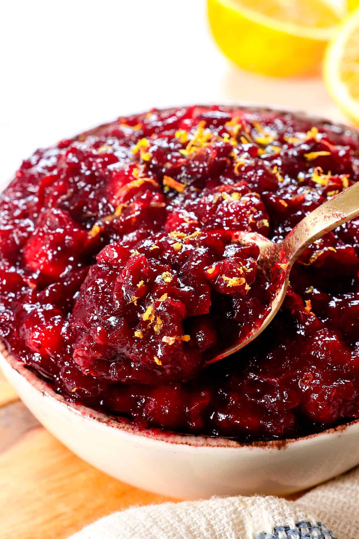 recipe for cranberry sauce being spooned showing the texture