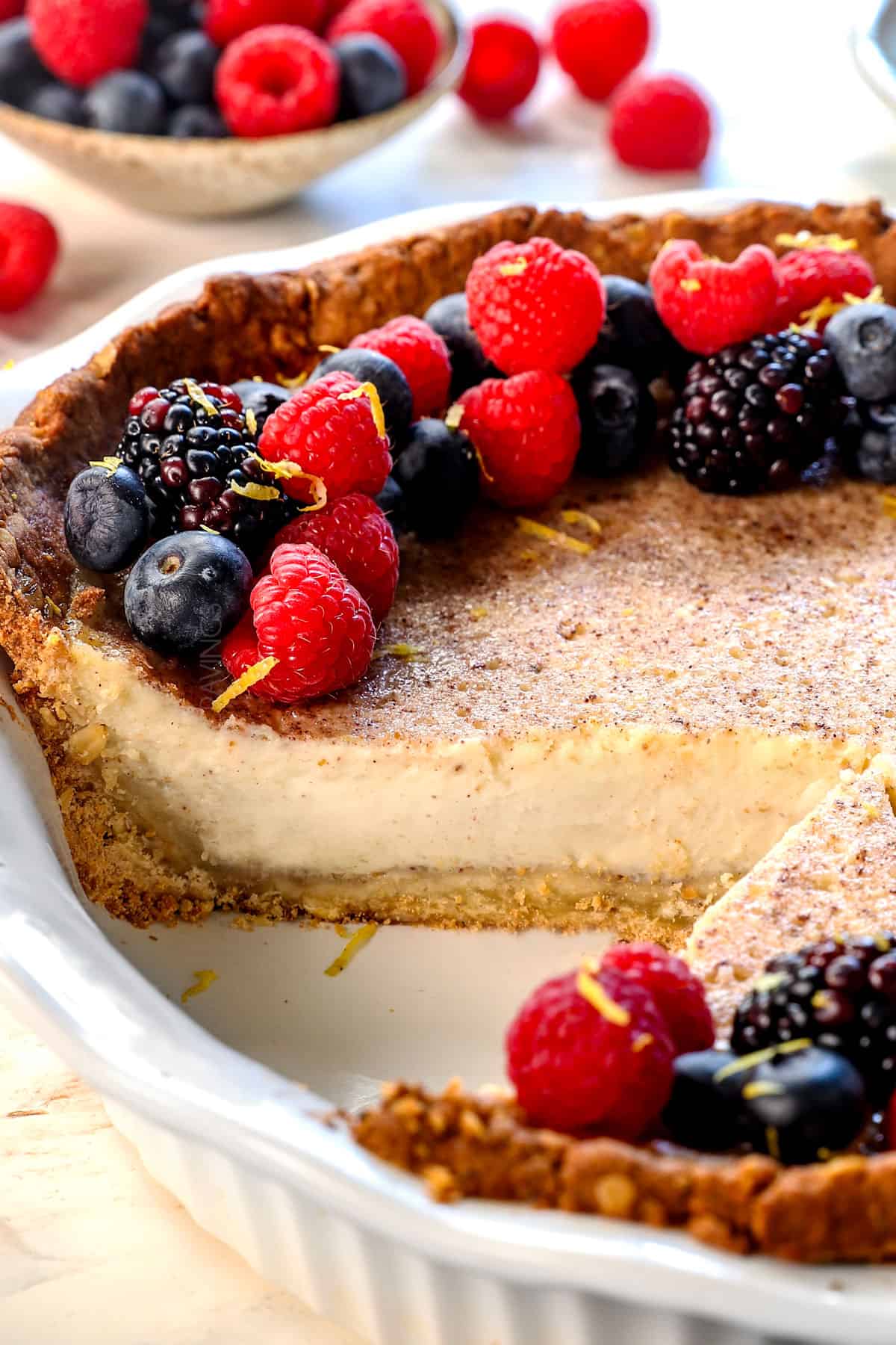 up close of custard pie recipe with a slice removed showing how creamy the pie is