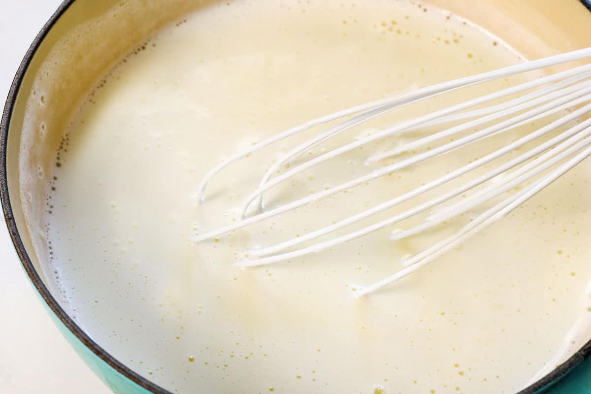 showing how to make custard pie by scalding the milk in a medium saucepan