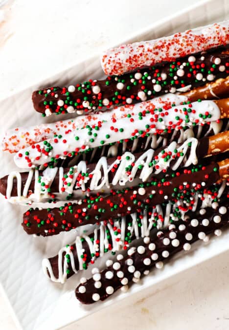 top view of chocolate dipped pretzels on a plate showing how to serve