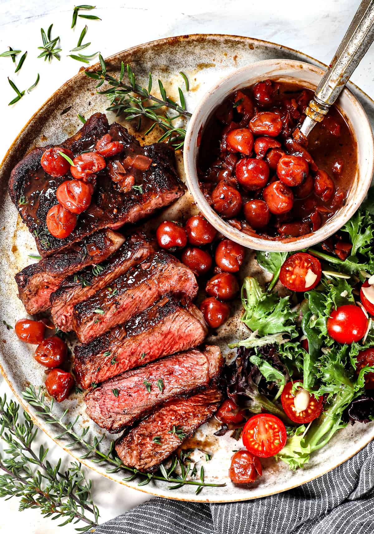 top view of sliced ribeye showing a perfectly cooked medium-rare steak