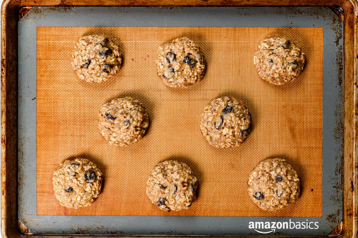 showing how to make cherry blossom cookie by baking the cookies until the edges are golden