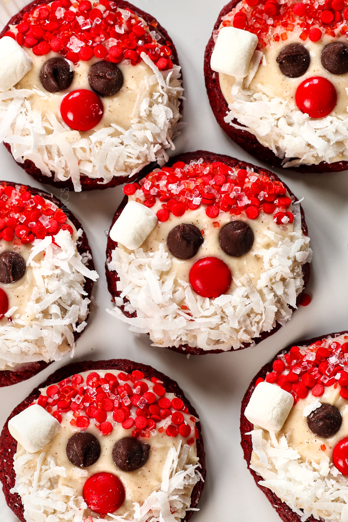 showing red velvet cookie variation by decorating the cookies to look like santa