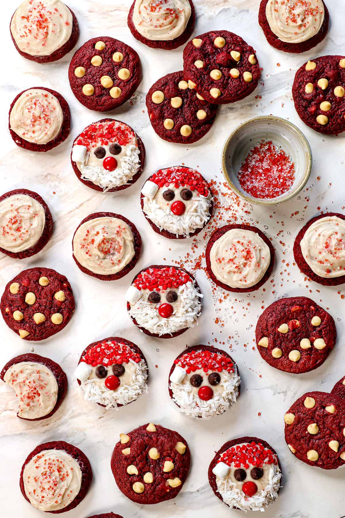 top view of red velvet cookie recipe with cream cheese frosting and sprinkles