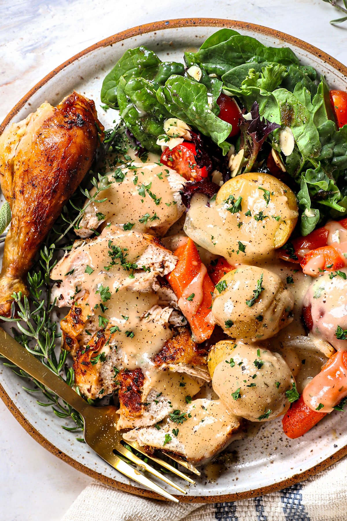 top view showing how to serve roasted chicken recipe on a plate with chicken gravy