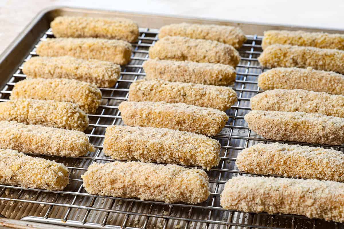 showing how to make mozzarella sticks by freezing on a baking sheet