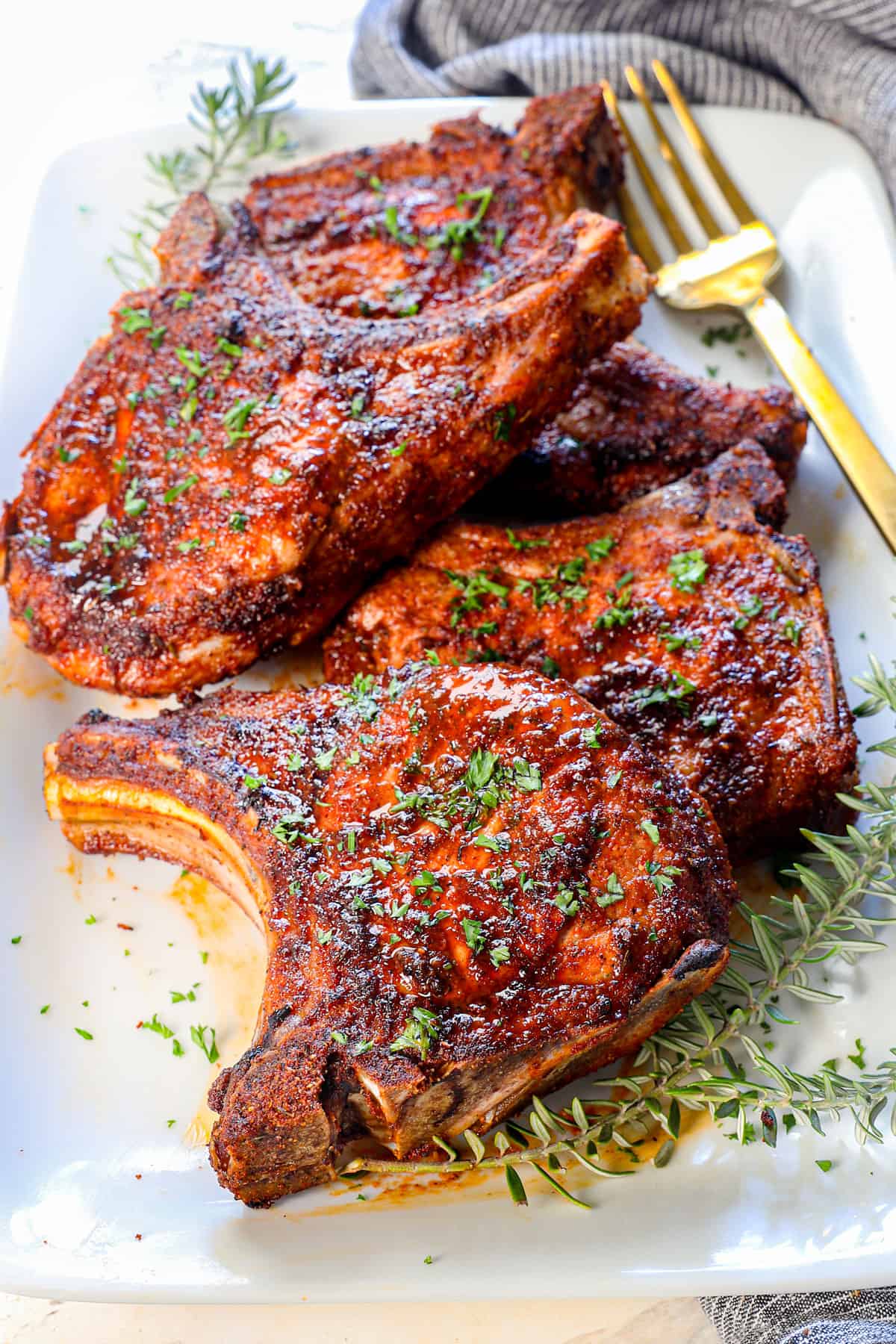 pork chops air fryer served on a platter garnished with parsley