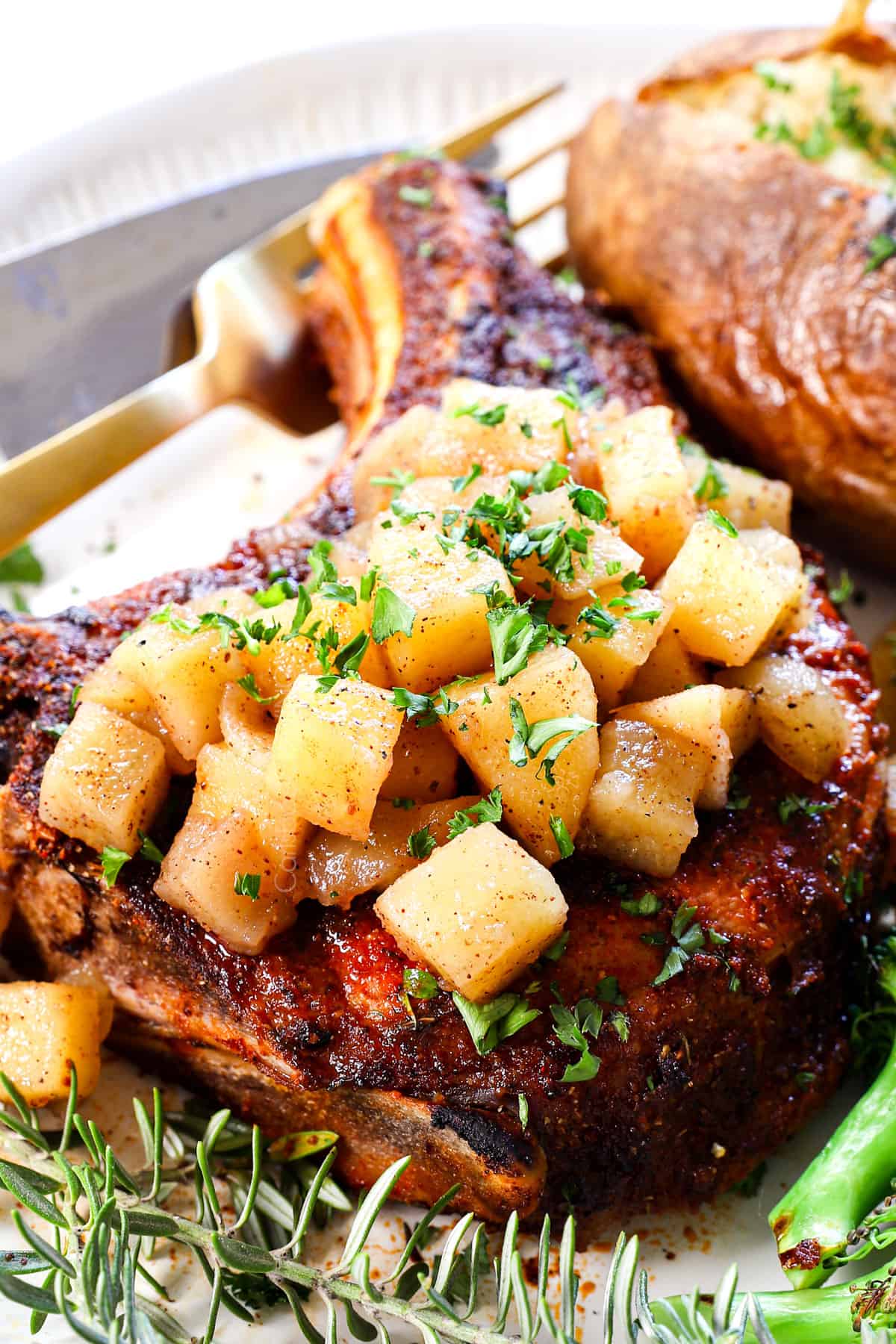 air fried pork chops with apple chutney on a plate showing how to serve it