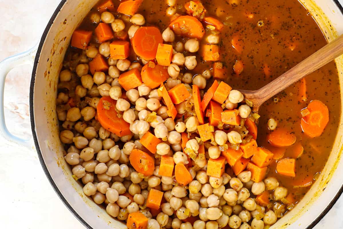 showing how to make vegetable soup by adding sweet potatoes, chickpeas and vegetable broth