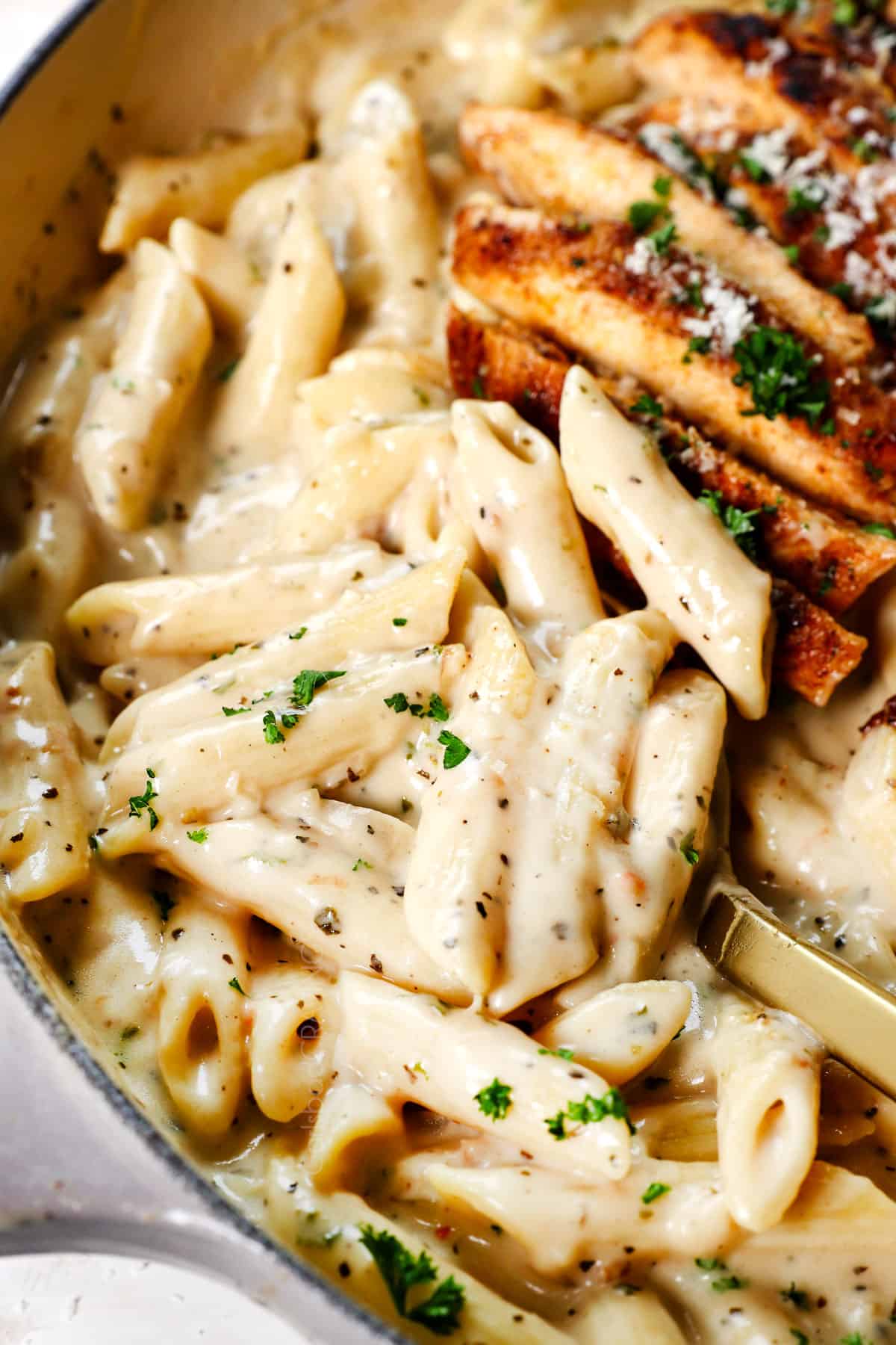 serving garlic parmesan pasta showing how creamy it is