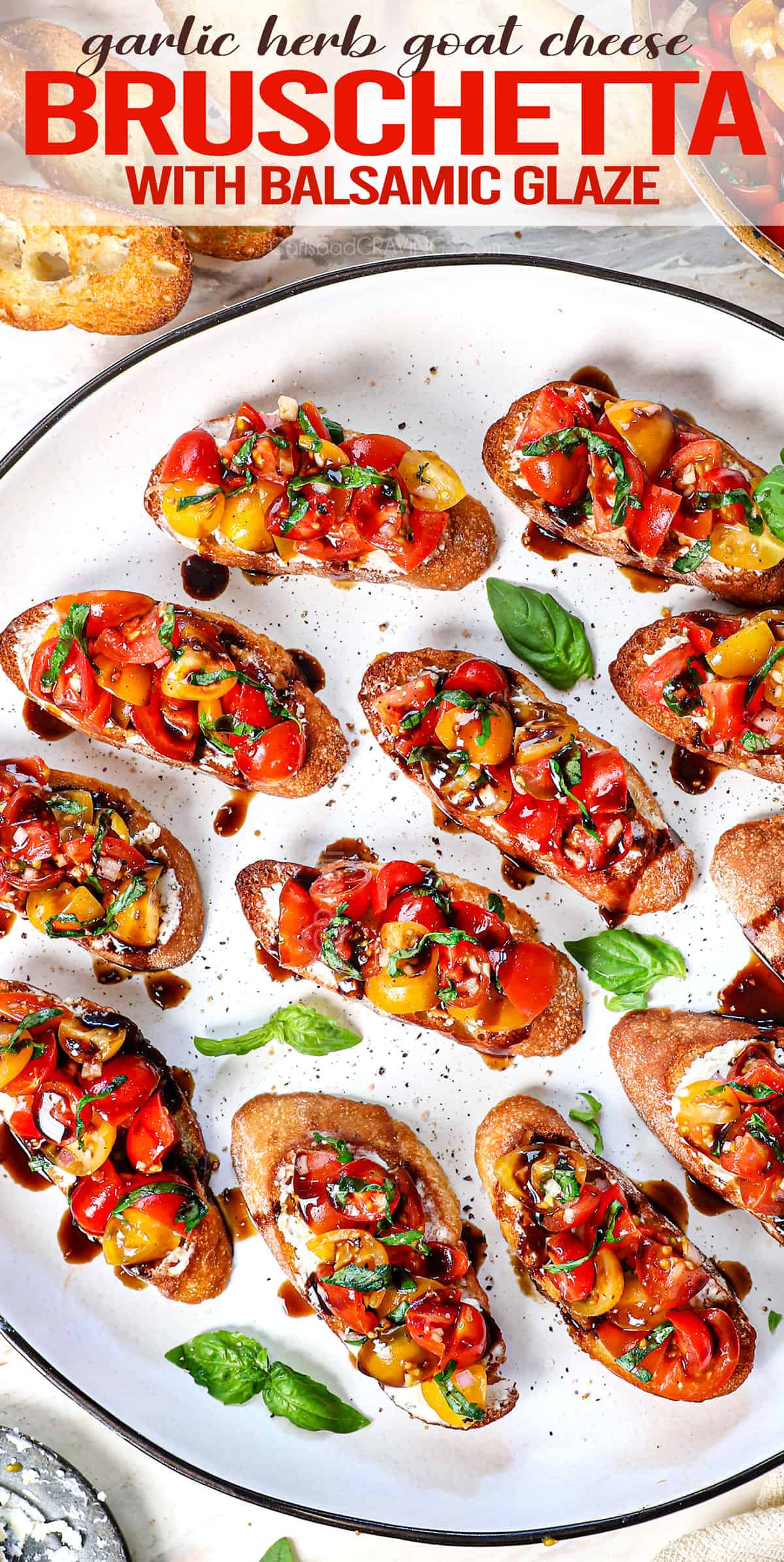 top view of bruschetta being served on a platter topped with tomatoes, basil, garlic and balsamic glaze