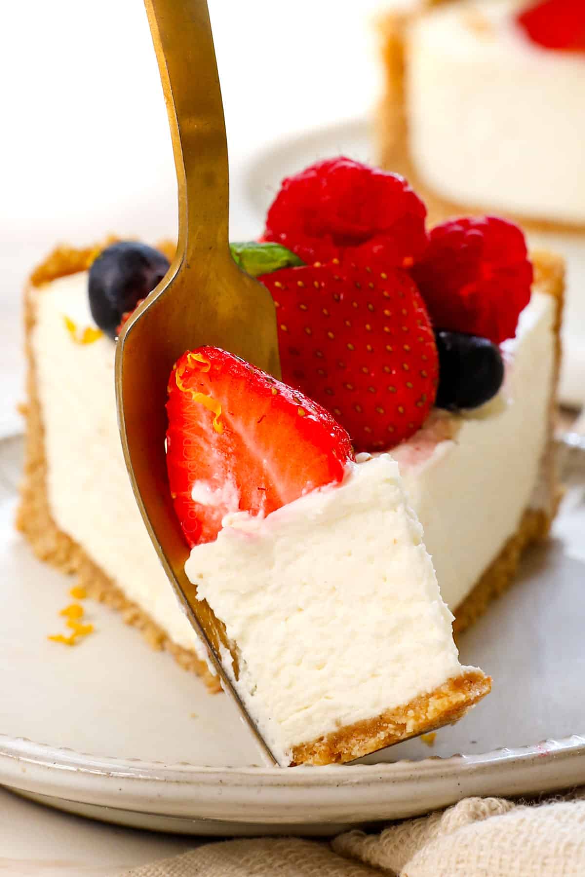 up close bite of no bake cheesecake showing how rich, creamy, and stable it is