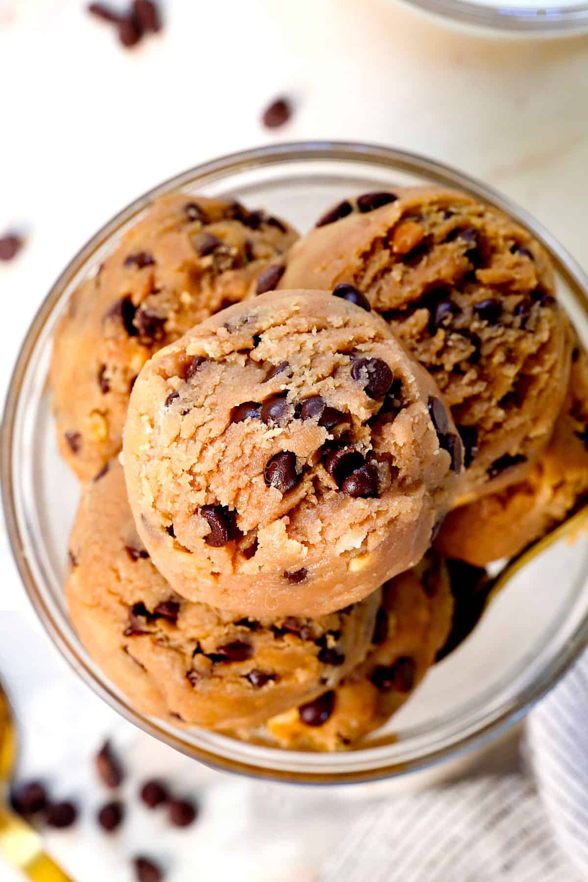 top view of dough edible cookie dough with chocolate chips and a golden spoon