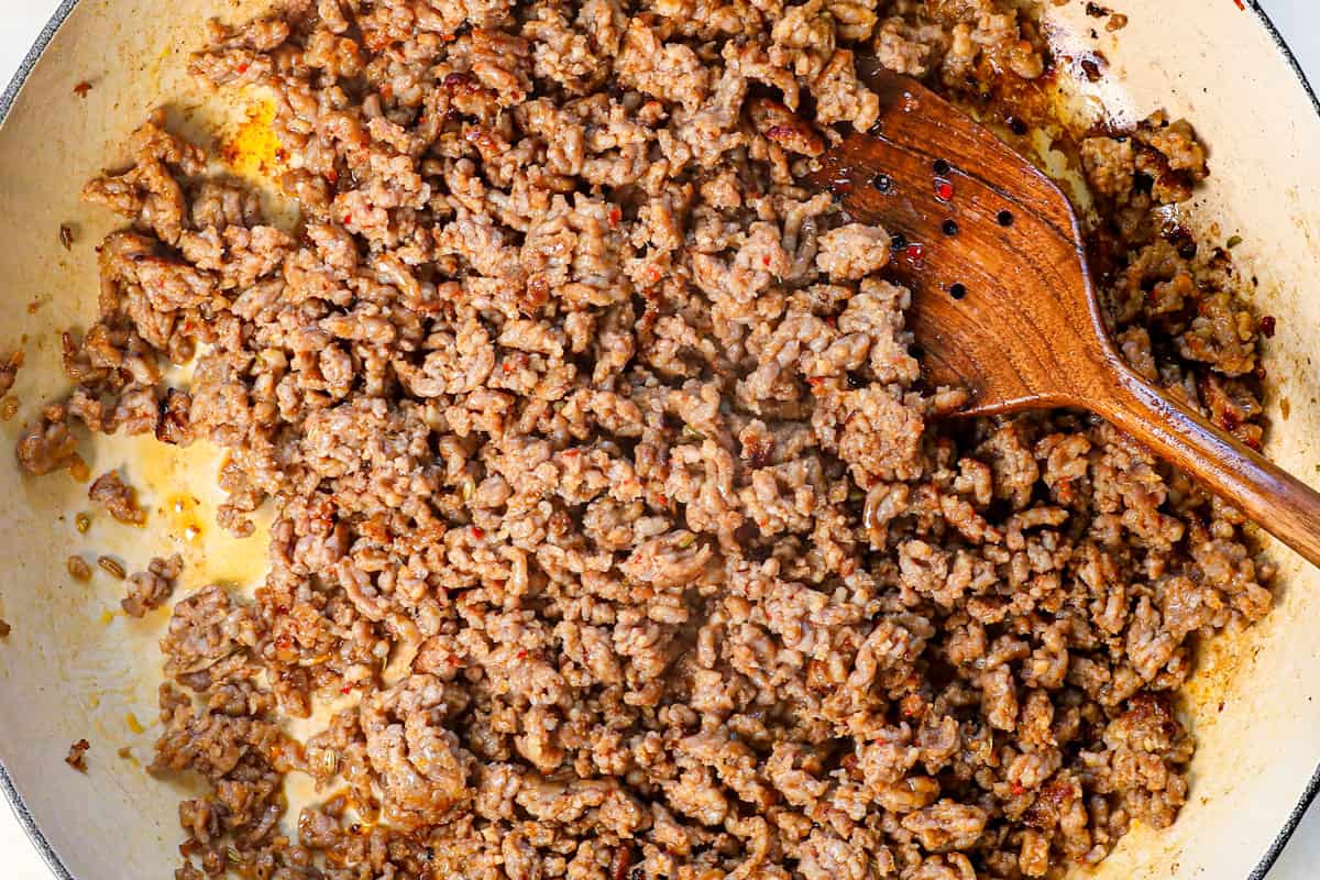 showing how to make cavatelli by cooking sausage