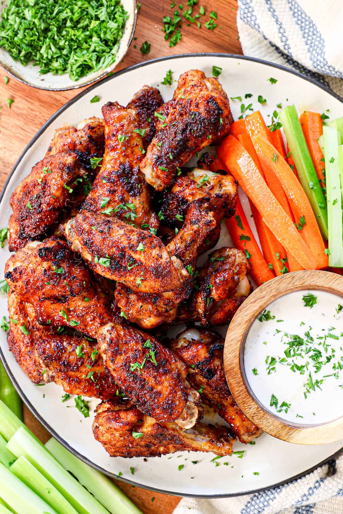 top view of serving air fryer chicken wings on a plate with ranch dip