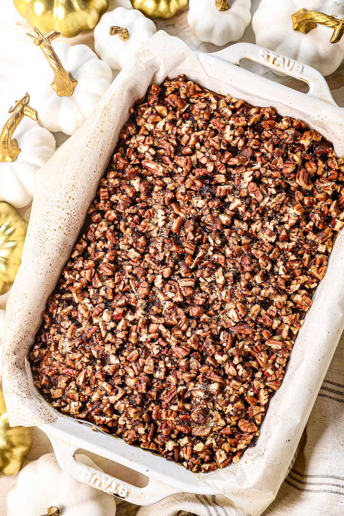 showing how to make pumpkin pie bars is cooling on a wire rack