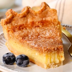 up close of chess pie recipe with a bite taken out showing how creamy it is