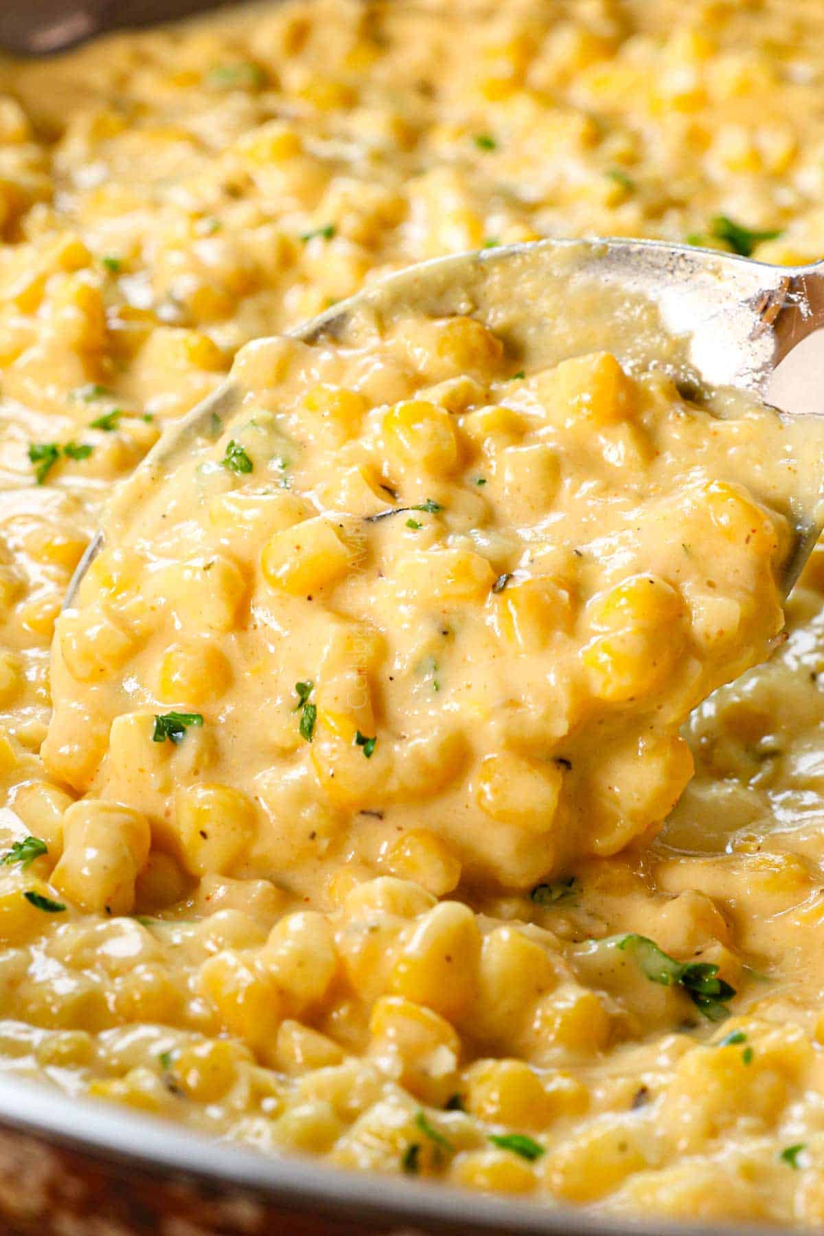 up close of stirring creamed corn showing how creamy it is