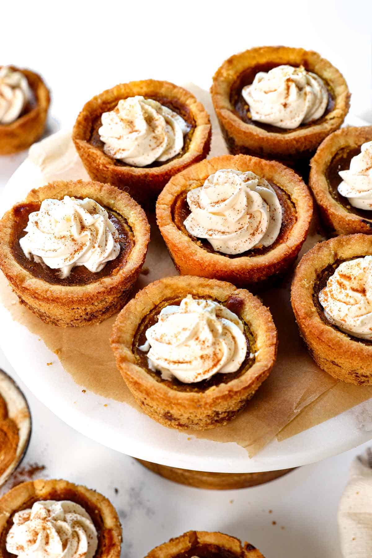 serving Mini Pumpkin Pies recipe on a cake stand