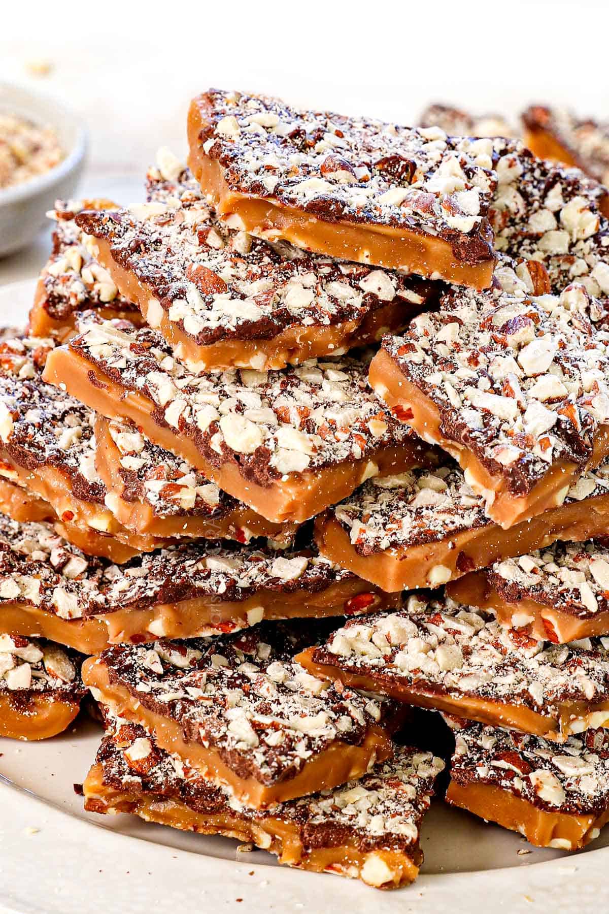 serving almond roca stacked on a plate