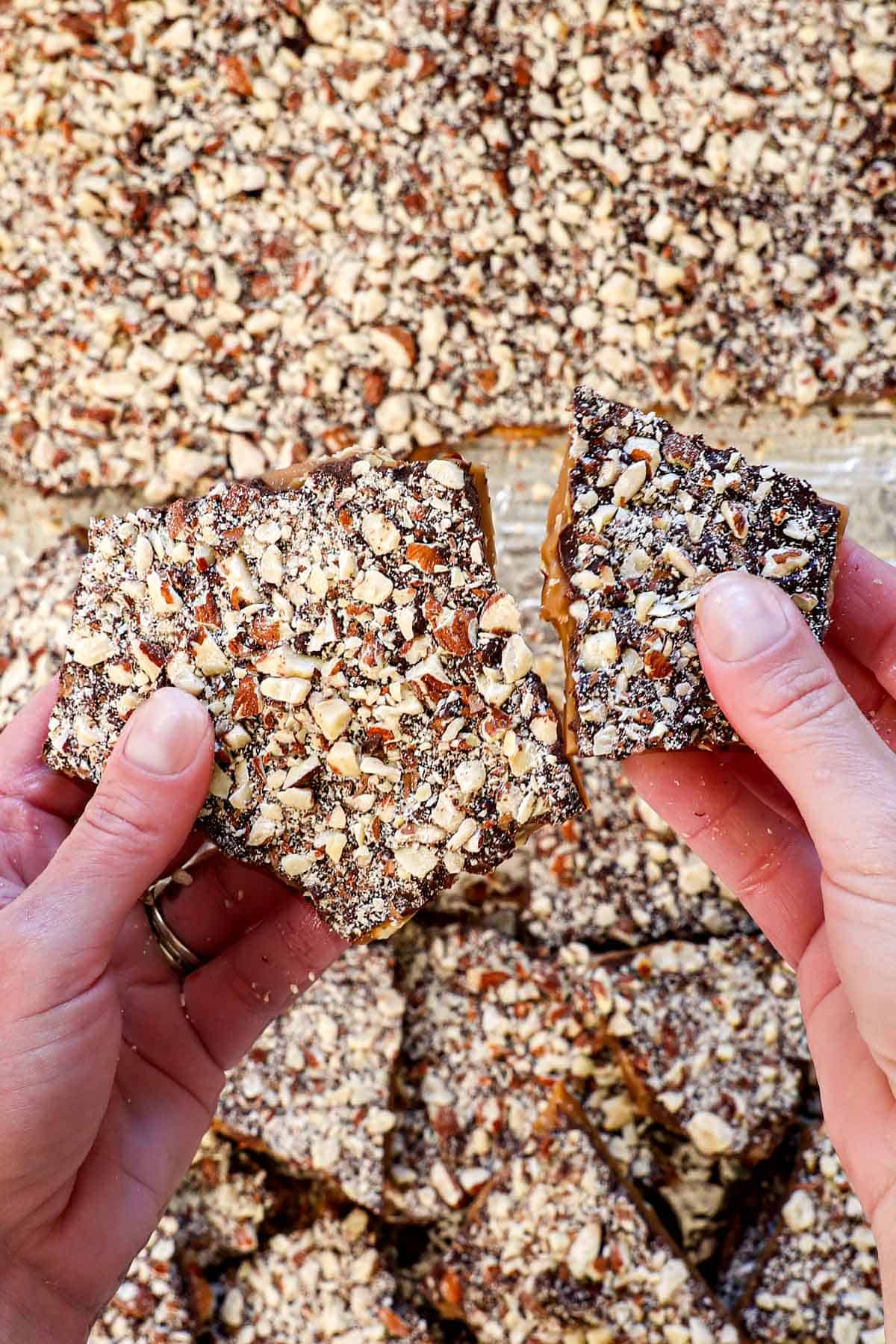 showing how to make almond roca by breaking apart by hand