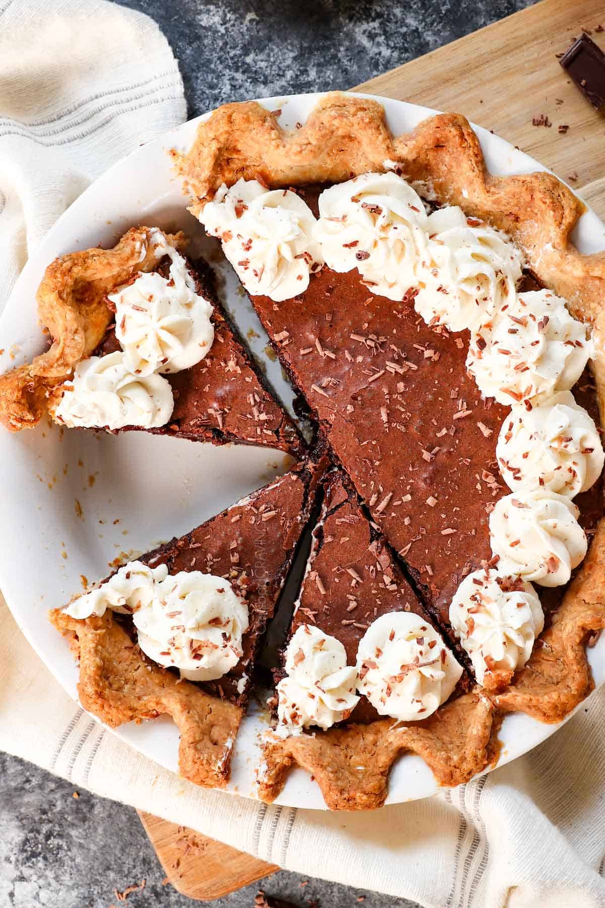 top view of chocolate chess pie recipe cut into slices topped with whipped cream