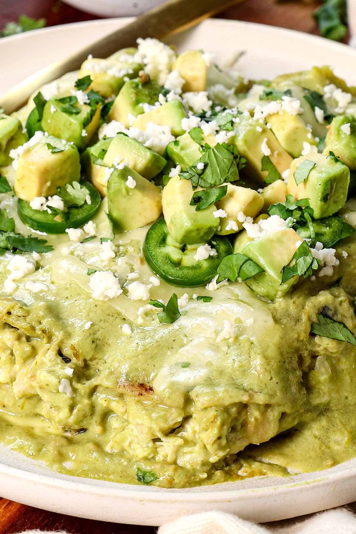 up close of a plate of enchiladas suizas recipe with three enchiladas covered in sauce