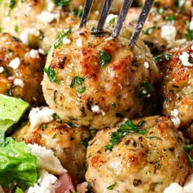 a fork piercing the best chicken meatballs to eat