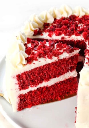 best red velvet cake recipe with a slice cut out
