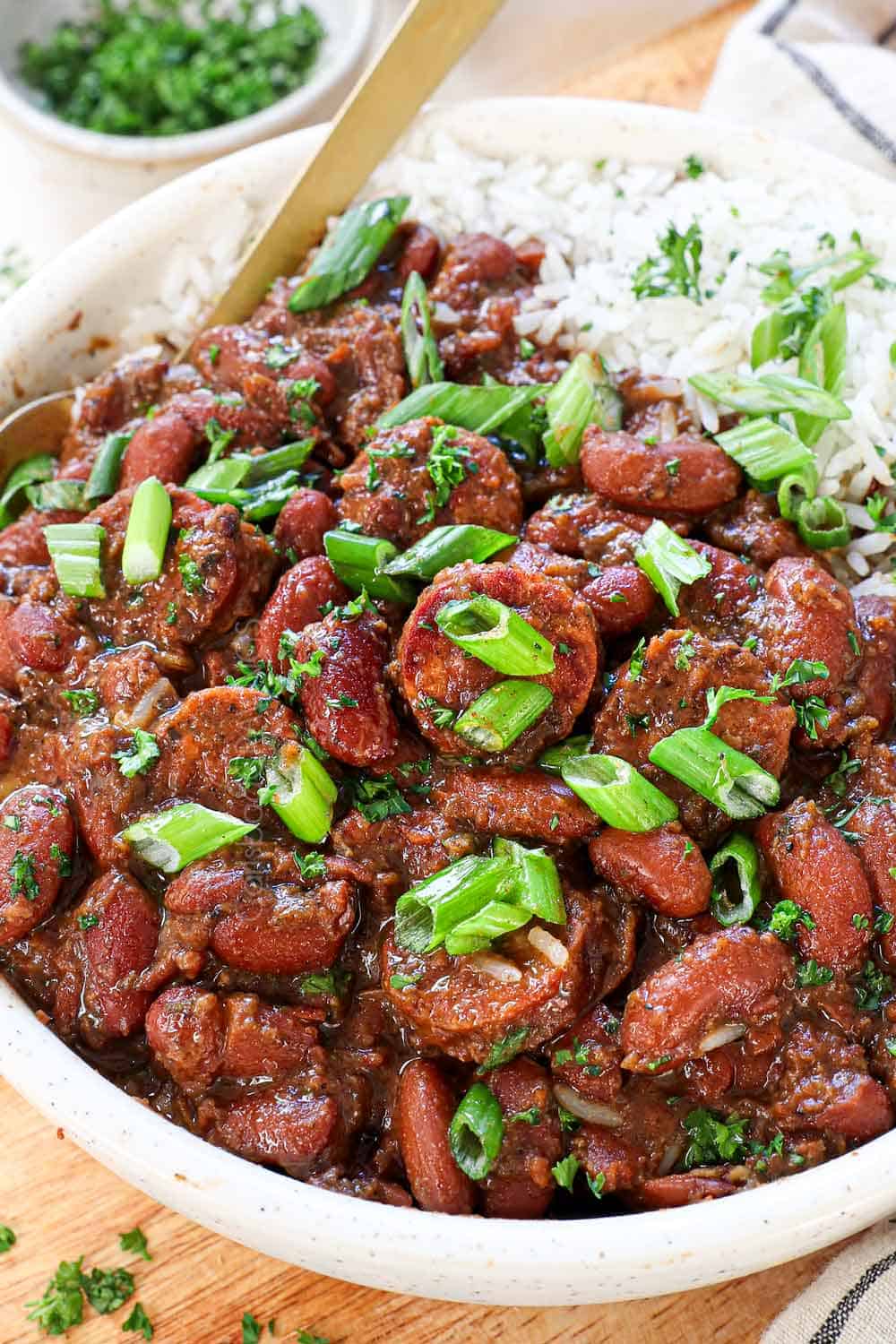 showing how to serve red beans and rice with sausage in a bowl