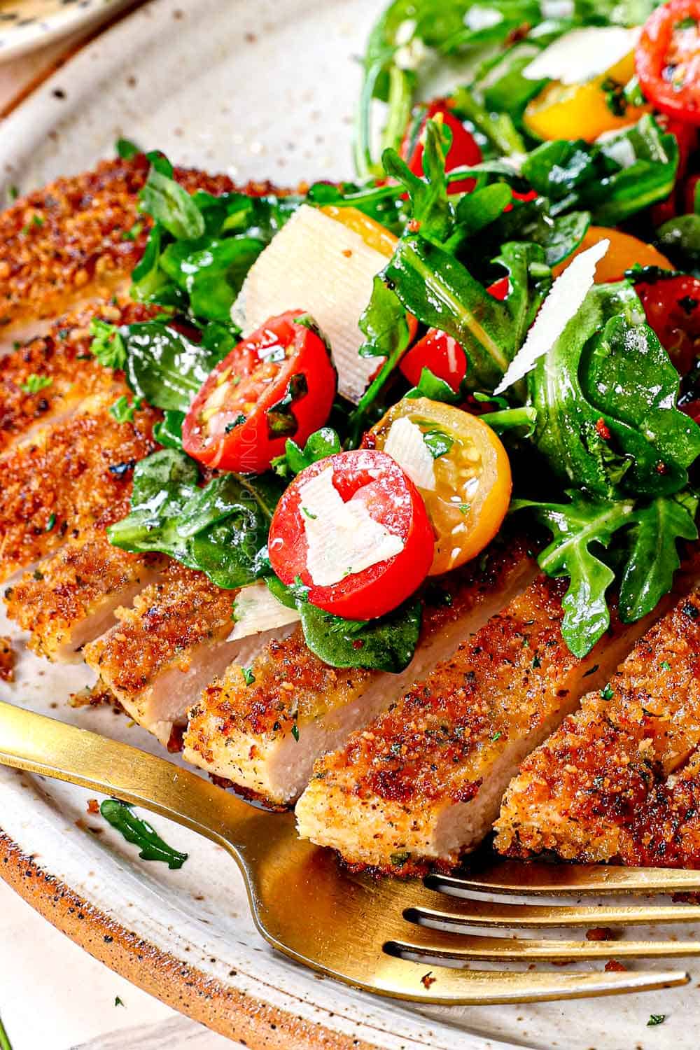 up close of Chicken Milanese and arugula salad