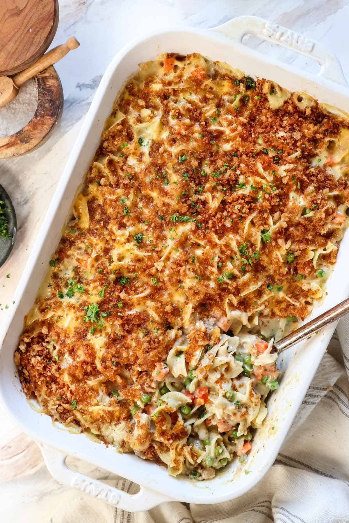 showing how to make chicken noodle casserole by baking until the cheese is melted