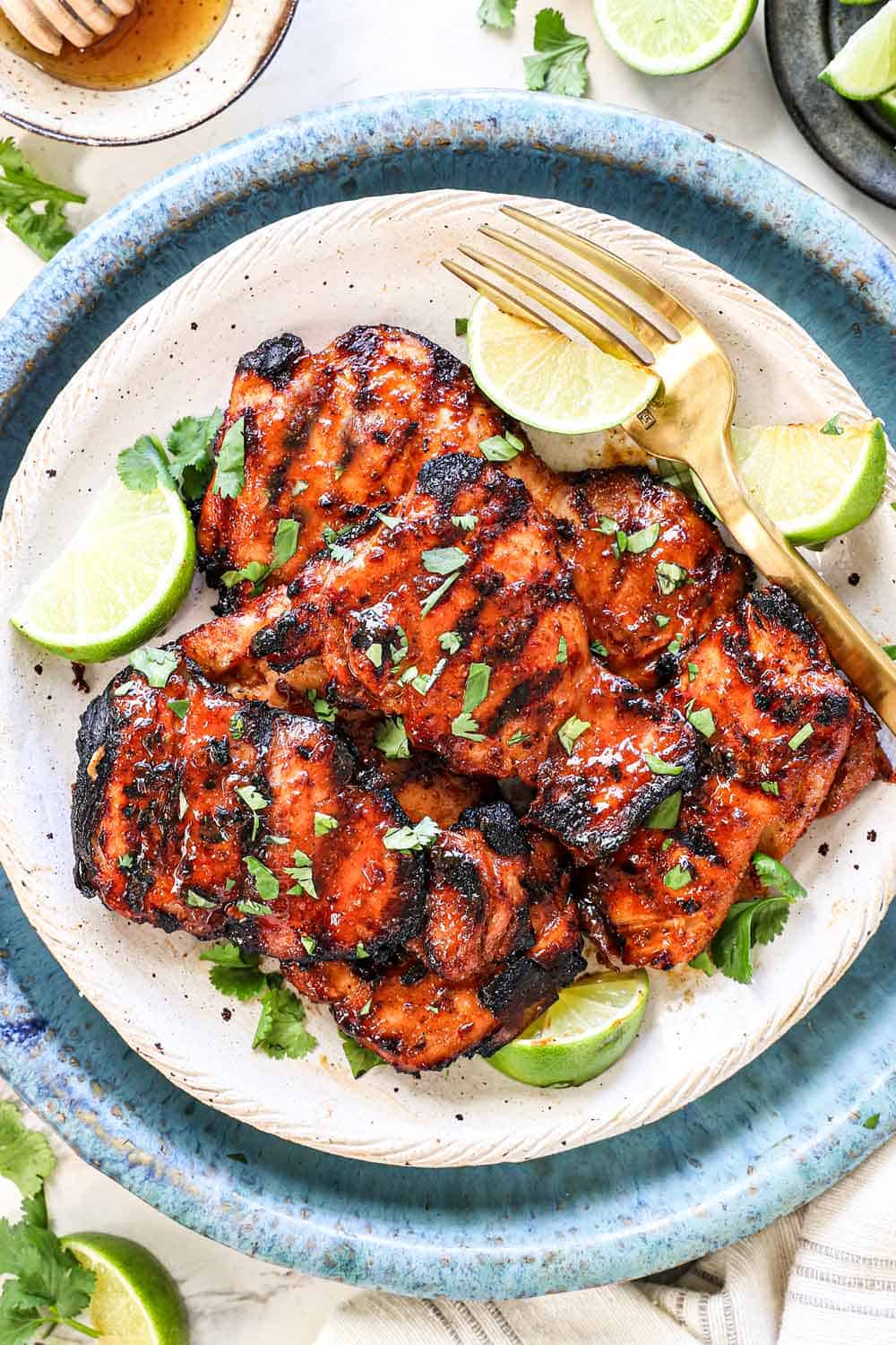 top view of chipotle honey chicken on a plate showing the gorgeous char and color