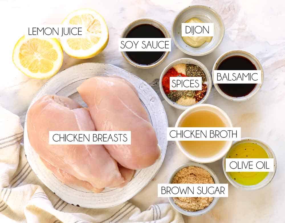 crockpot chicken recipe ingredients: chicken breasts, lemon juice, soy sauce, balsamic, Dijon, olive oil, chicken broth, and spices