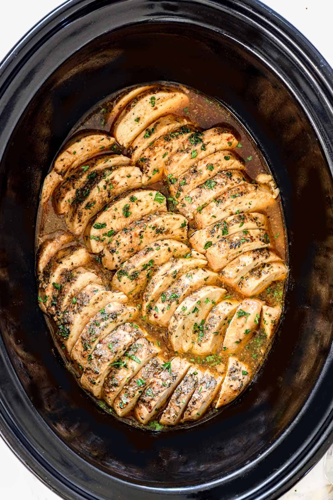 easy chicken crockpot recipe sliced in the slow cooker