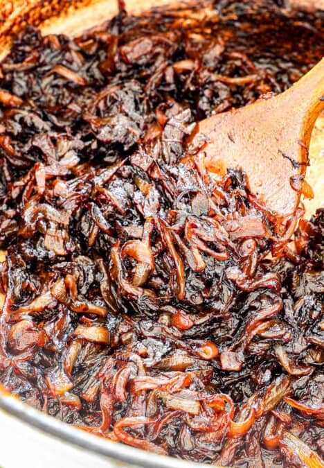 up close of caramelized onions showing how deeply caramelized and dark, and jammy they are