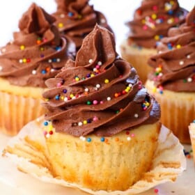 up close of chocolate buttercream frosting on a cupcake showing how thick and pipable it is