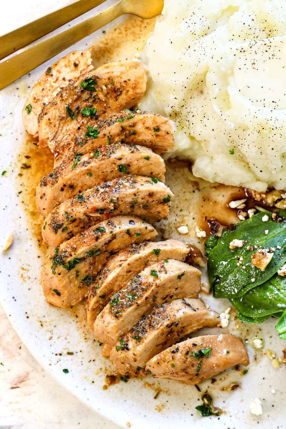 top view of serving crockpot chicken sliced on a plate serving it with mashed potatoes