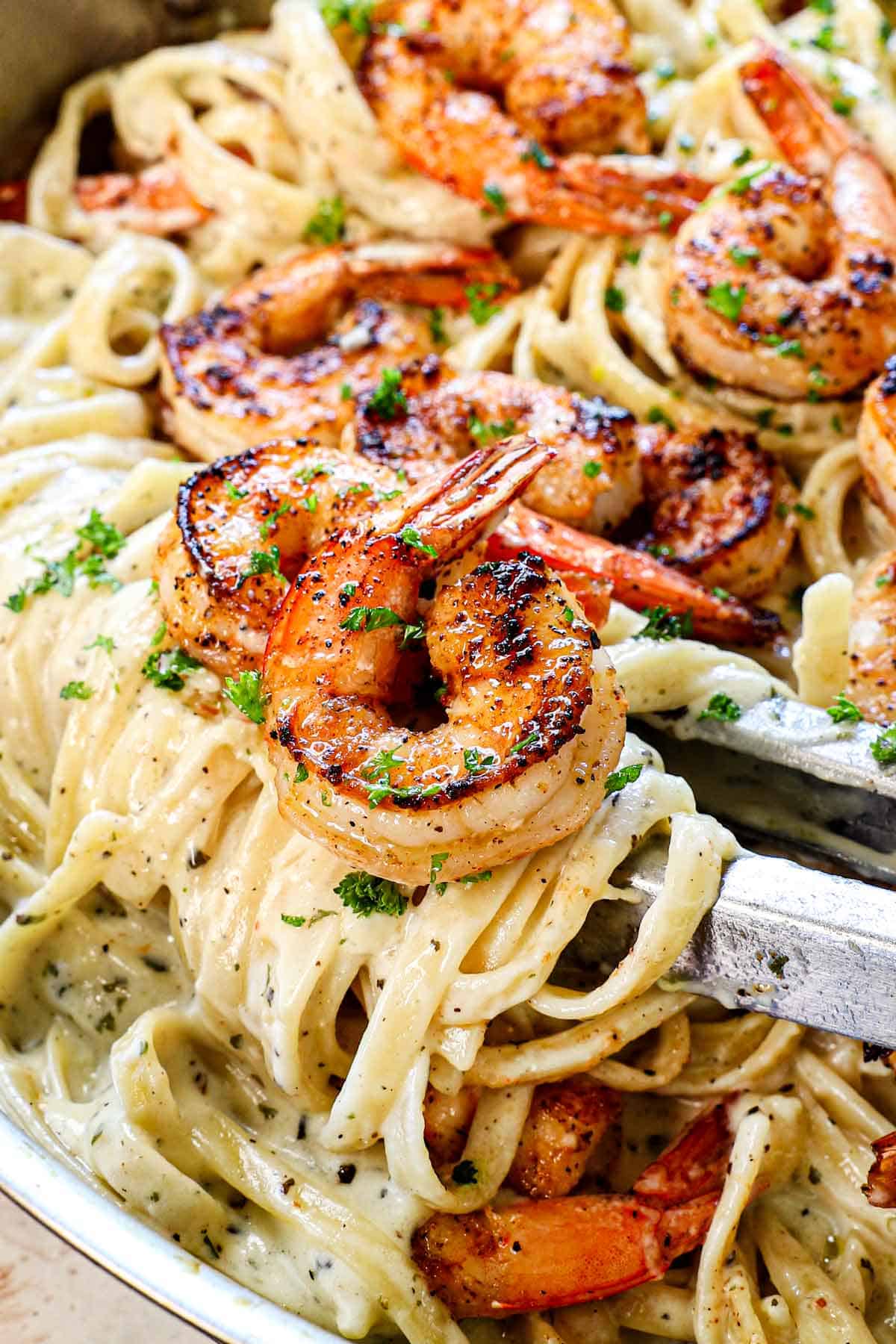 up close of shrimp fettuccine alfredo recipe showing cajun shrimp