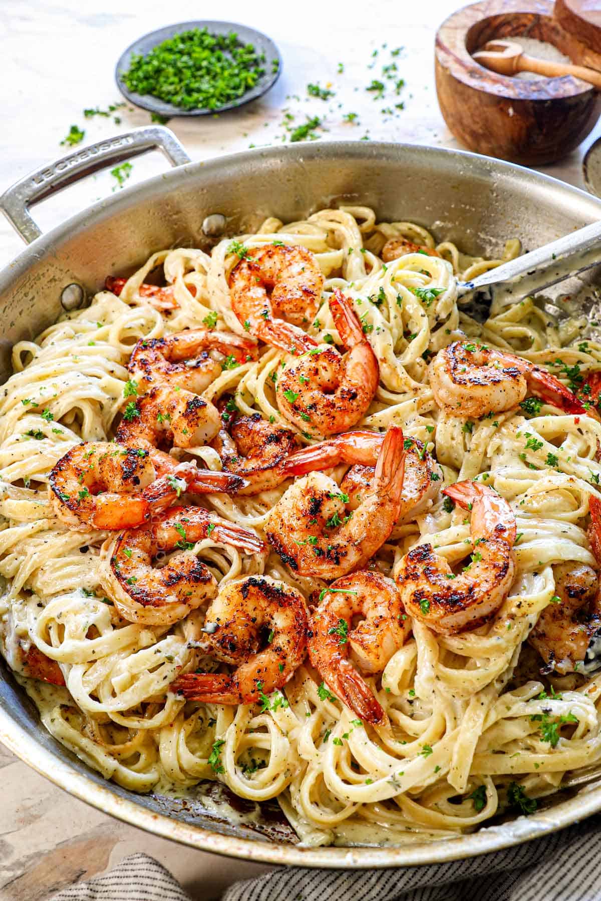 shrimp alfredo recipe in a skillet showing how creamy the pasta is
