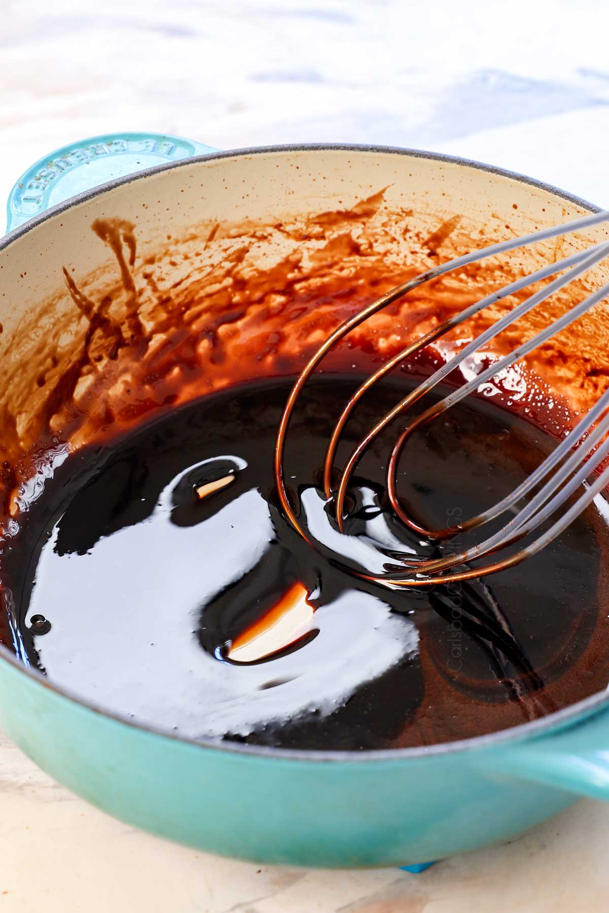 showing how to make balsamic glaze by removing from heat to cool to perfect consistency