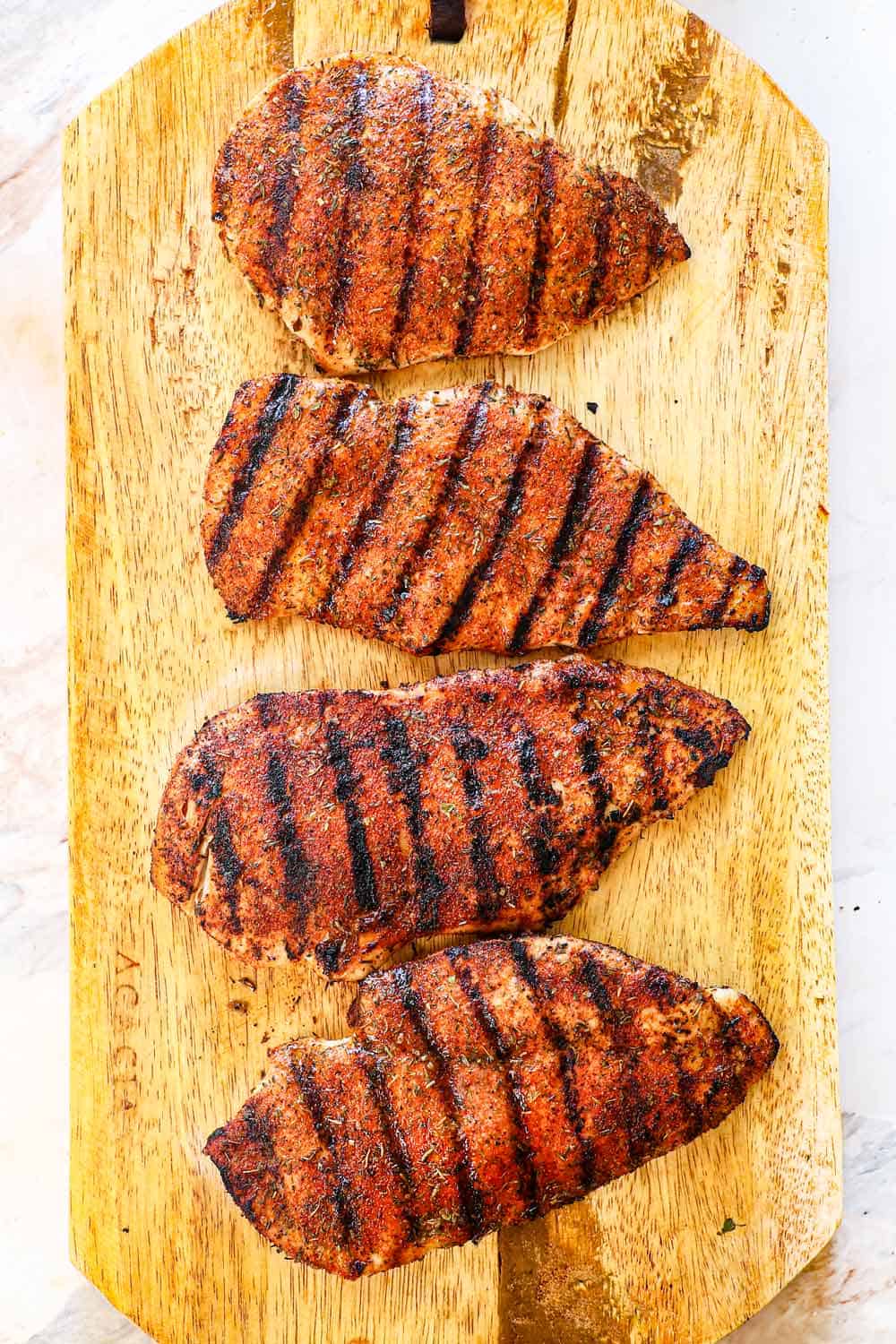 showing how to make chicken sandwiches by letting the chicken rest after grilling