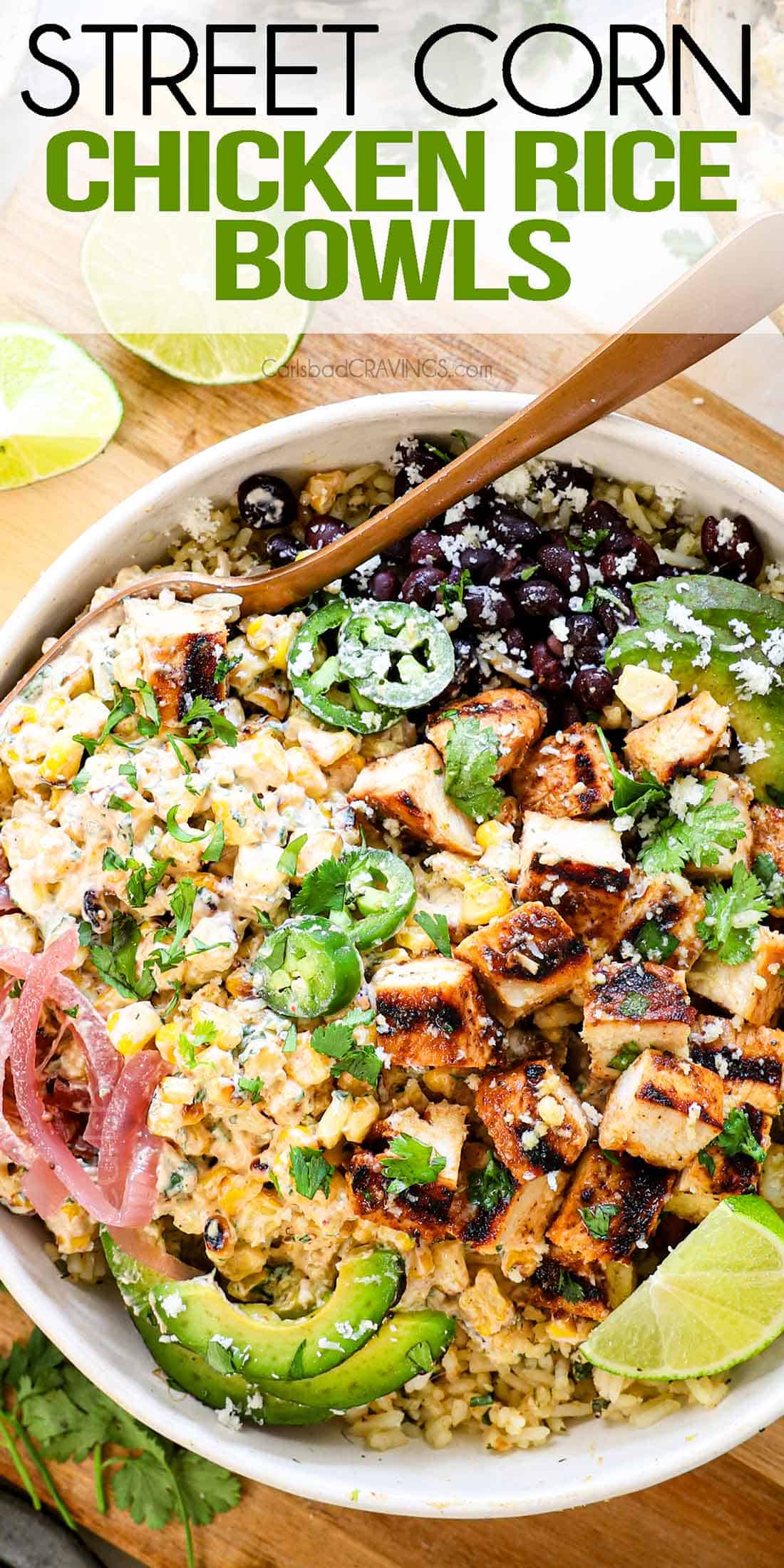 top view of street corn chicken rice bowl with Mexican street corn, Mexican chicken, cilantro lime rice, black beans, pickled red onions, cilantro, cotija and jalapeno
