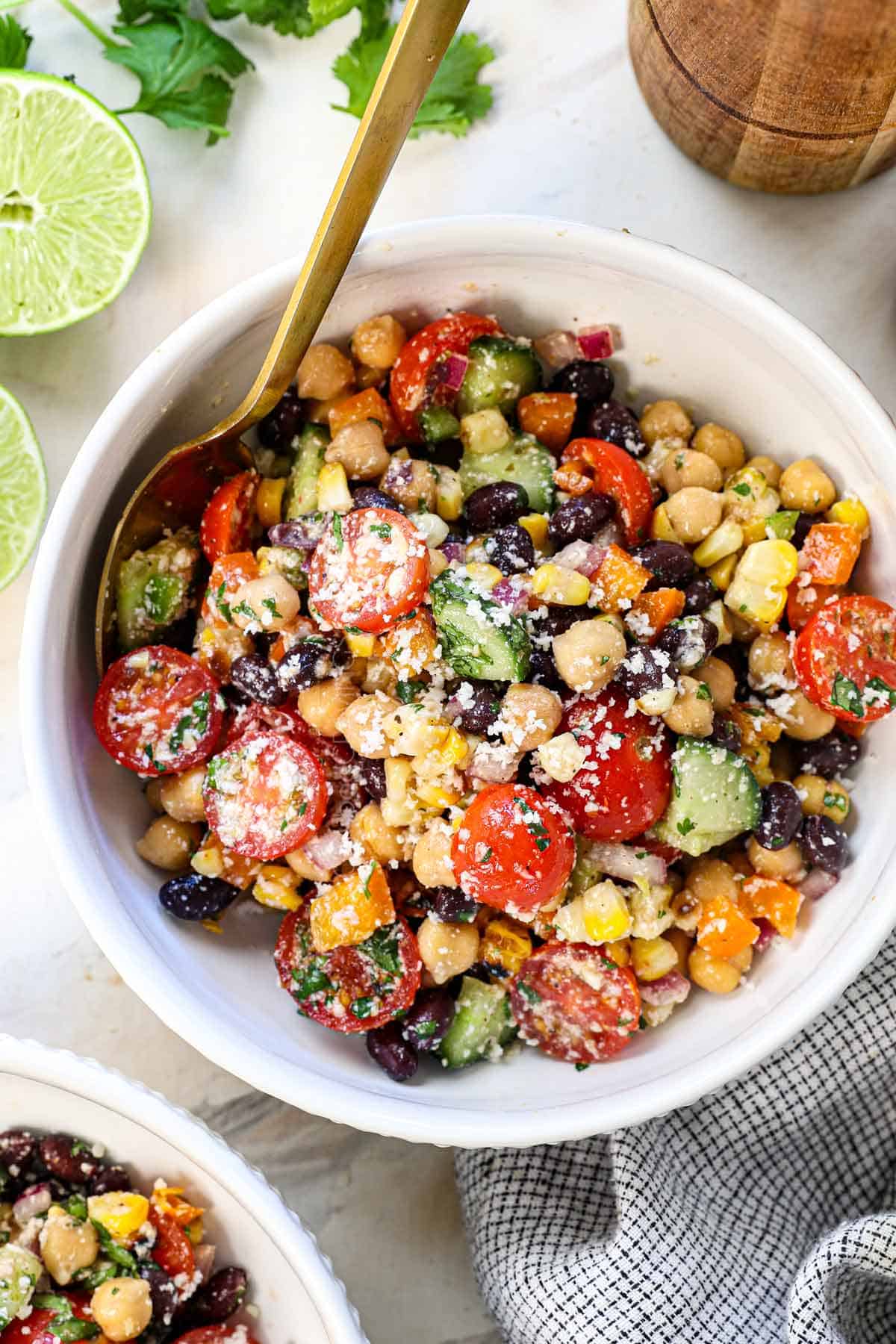 top view of an individual serving of Mexican Dense Bean Salad in a bowl showing all the beans and vegetables