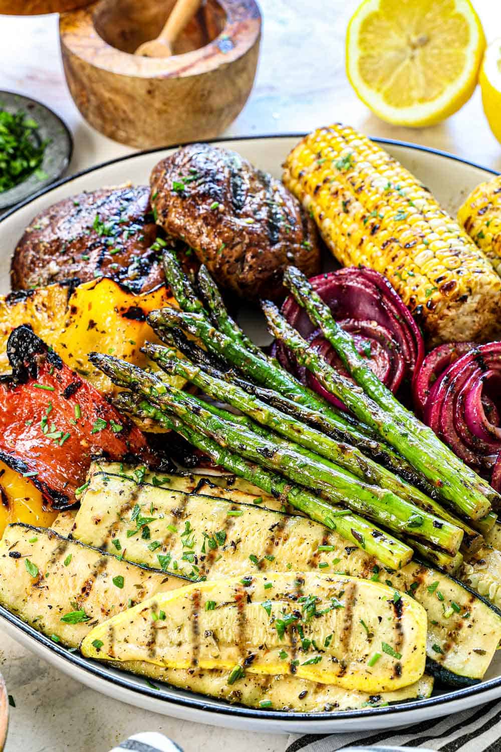 side view of grilling vegetables on the grill recipe being served on a platter showing the grill marks