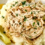 showing how to serve Mississippi chicken over mashed potatoes garnished with parsley