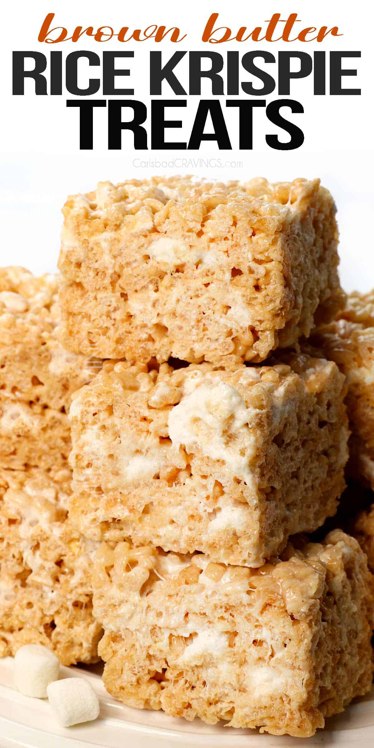 rice Krispie treats on a plate showing how chewy and gooey they are with pockets of marshmallows