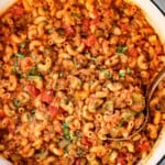 top view of chop suey recipe in a Dutch oven garnished with parsley